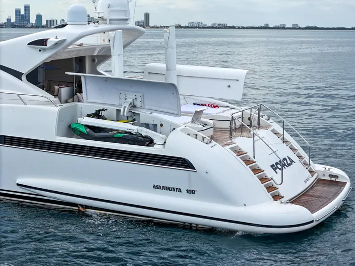  Yacht Photos Pics Luxury 2002 Mangusta 108 yacht on water, featuring sleek design and spacious deck.