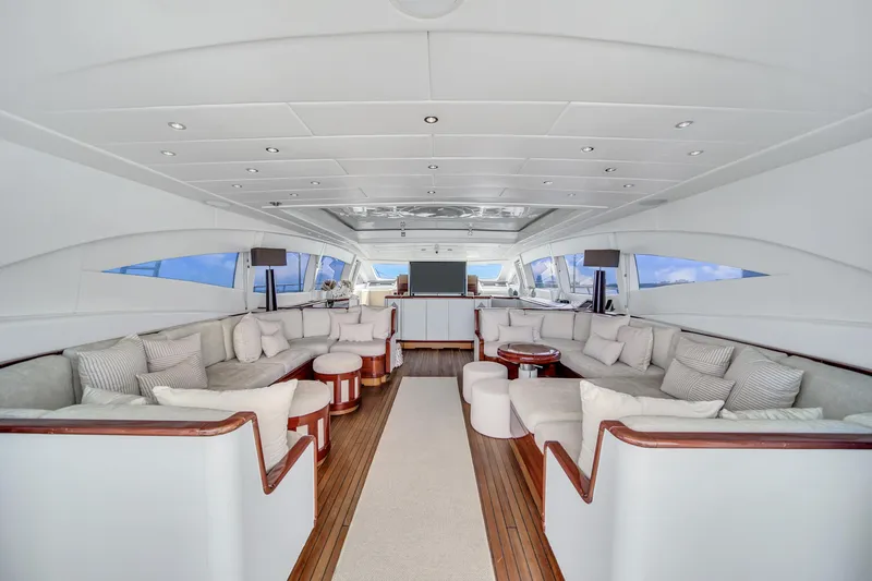  Yacht Photos Pics Luxurious interior of 2002 Mangusta 108 yacht with elegant seating and modern design.