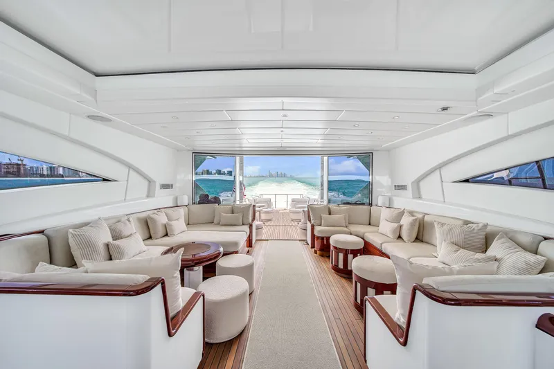  Yacht Photos Pics Luxurious interior of 2002 Mangusta 108 yacht with elegant seating and ocean view.
