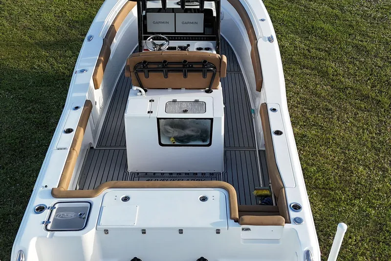  Yacht Photos Pics 2023 Seahunt 30 GameFish Coffin Box boat, interior view with seating and controls.