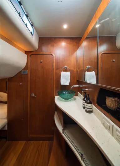 T 2 Yacht Photos Pics Luxurious 2006 Tiara Yachts 4300 Sovran bathroom with wood accents and modern fixtures.