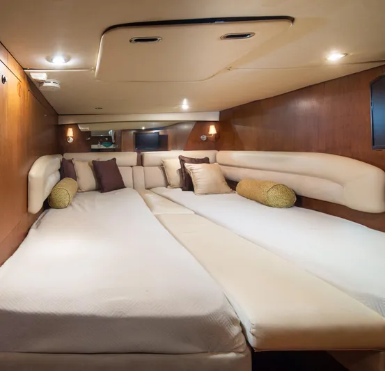 T 2 Yacht Photos Pics Luxurious cabin interior of 2006 Tiara Yachts 4300 Sovran with plush bedding and ambient lighting.