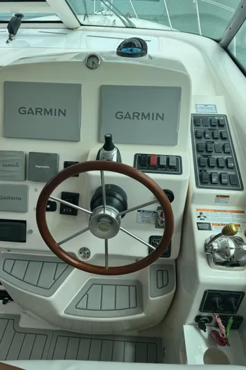 T 2 Yacht Photos Pics 2006 Tiara Yachts 4300 Sovran helm with Garmin navigation displays and wooden steering wheel.