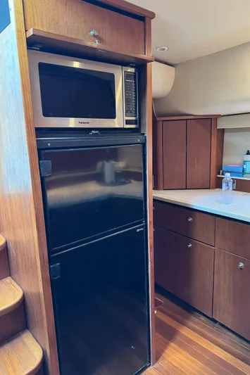 T 2 Yacht Photos Pics 2006 Tiara Yachts 4300 Sovran galley with microwave and refrigerator.