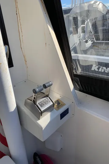 Paradosi Yacht Photos Pics Control panel inside a 1990 Nova 4500 boat, featuring dual throttle levers.