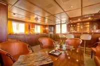 Luxurious 1982 Custom Husumer Shipyard interior with elegant seating and warm lighting.