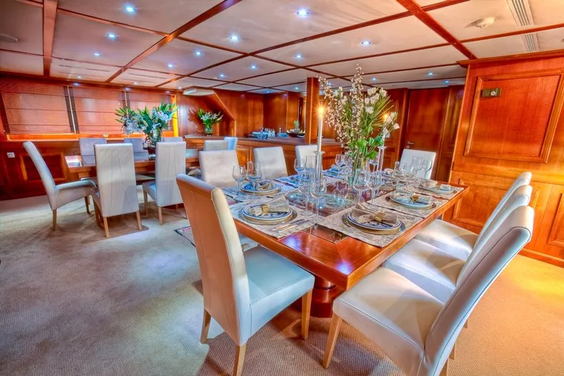 Sanssouci Star Yacht Photos Pics Luxurious yacht dining room with elegant table setting, custom Husumer Shipyard, 1982.