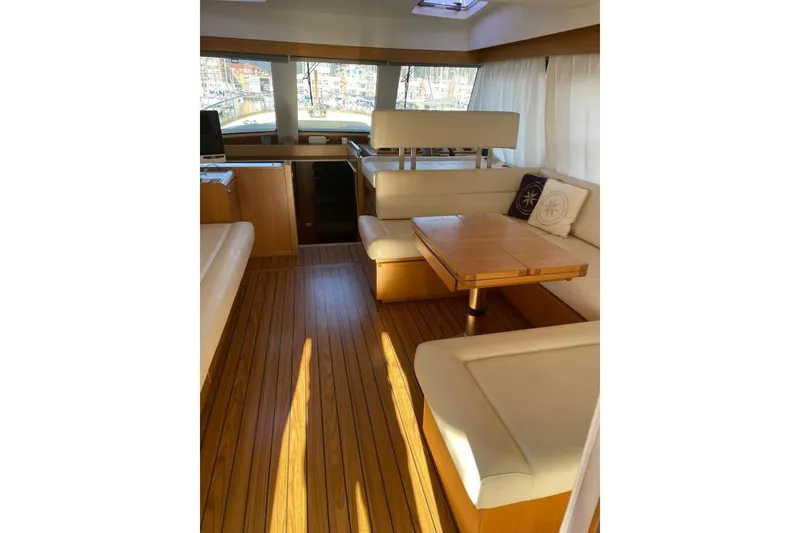  Yacht Photos Pics Luxurious interior of 2007 Apreamare 48 yacht with elegant wood flooring and plush seating.