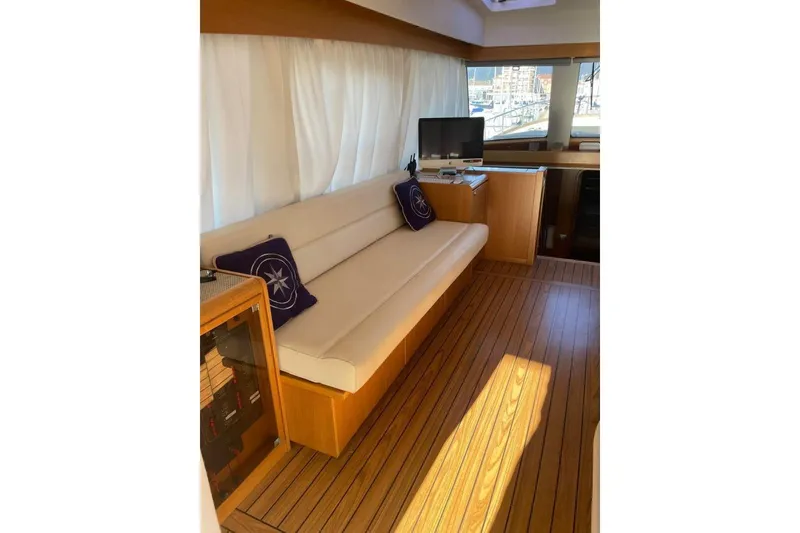  Yacht Photos Pics Luxurious interior of 2007 Apreamare 48 yacht with wooden flooring and elegant seating.