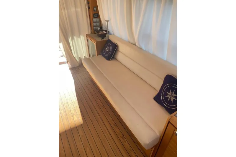  Yacht Photos Pics Luxurious interior of 2007 Apreamare 48 yacht with elegant beige seating and nautical decor.