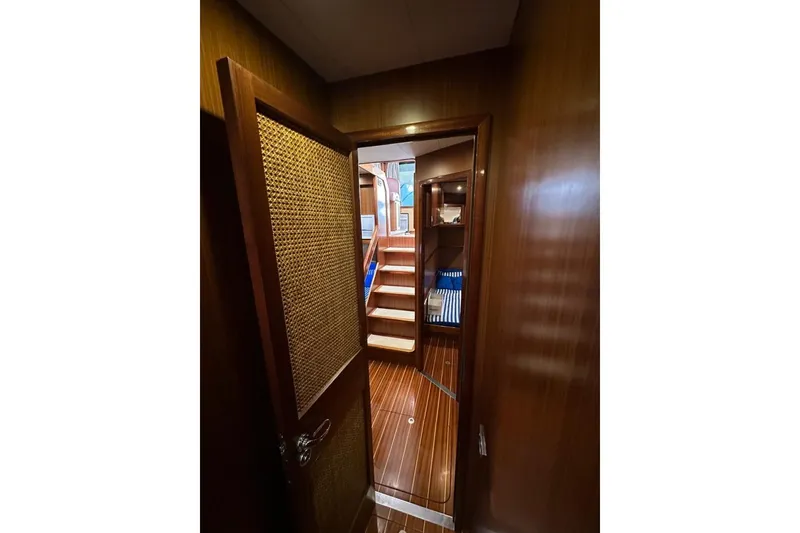 Yacht Photos Pics Interior view of 2007 Apreamare 48 yacht with wooden finishes and stairs.
