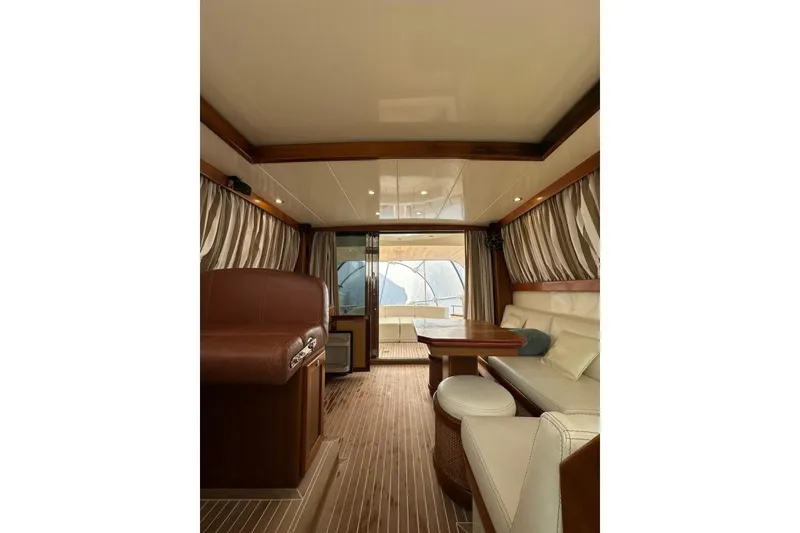  Yacht Photos Pics Interior of 2007 Apreamare 48 yacht with elegant seating and wooden finishes.