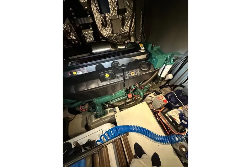  Yacht Photos Pics Engine room of 2007 Apreamare 48 yacht, featuring mechanical components and tools.