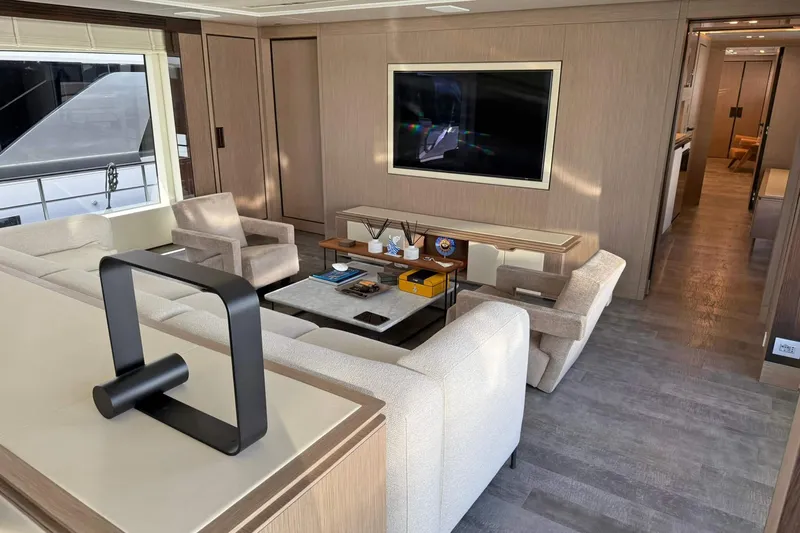 Ship Happens Yacht Photos Pics Luxurious interior of 2024 Maiora 30 Walkaround yacht with modern furnishings and large TV.