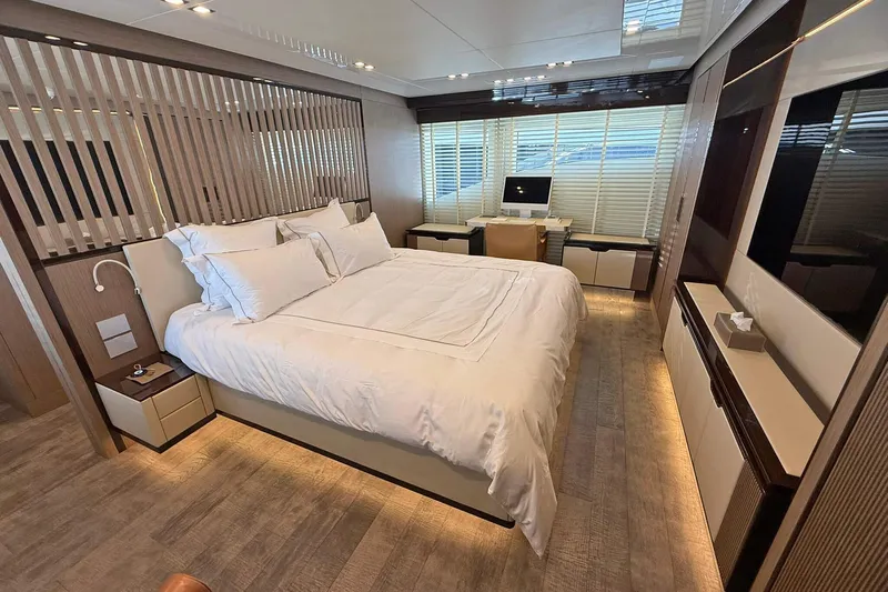 Ship Happens Yacht Photos Pics Luxurious bedroom interior of 2024 Maiora 30 Walkaround yacht with modern design.