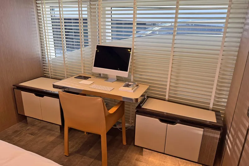 Ship Happens Yacht Photos Pics Luxurious interior of 2024 Maiora 30 Walkaround yacht with modern desk setup.