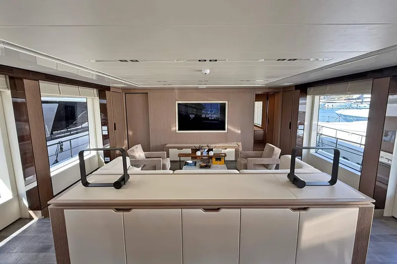 Ship Happens Yacht Photos Pics Luxurious interior of 2024 Maiora 30 Walkaround yacht with modern furnishings and large windows.