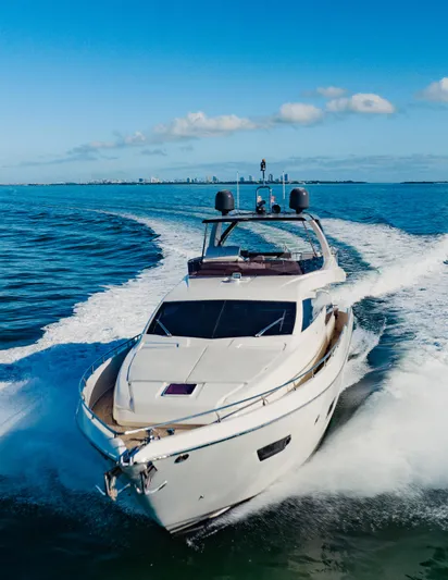 Sami Kay III Yacht Photos Pics Luxurious 2017 Ferretti Yachts 750 cruising on open water under clear blue skies.
