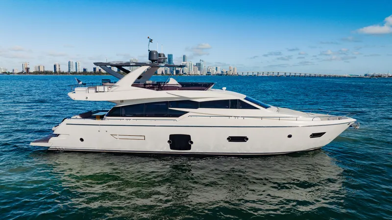 Sami Kay III Yacht Photos Pics 2017 Ferretti Yachts 750 cruising on blue ocean with city skyline backdrop.