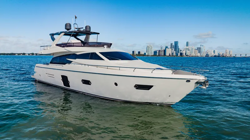 Sami Kay III Yacht Photos Pics 2017 Ferretti Yachts 750 on water with city skyline in background.