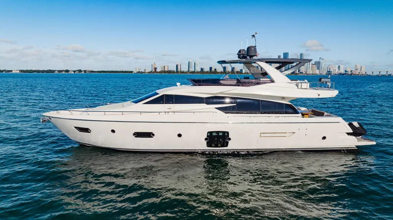 Sami Kay III Yacht Photos Pics 2017 Ferretti Yachts 750 cruising on blue waters with city skyline in background.
