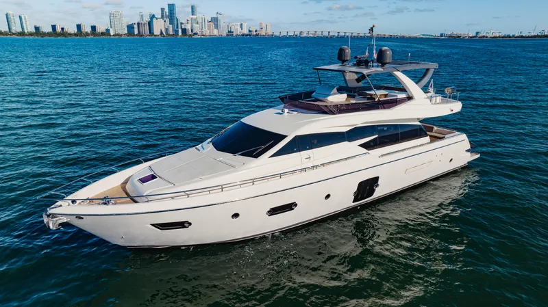 Sami Kay III Yacht Photos Pics Luxurious 2017 Ferretti Yachts 750 cruising on blue waters near a city skyline.