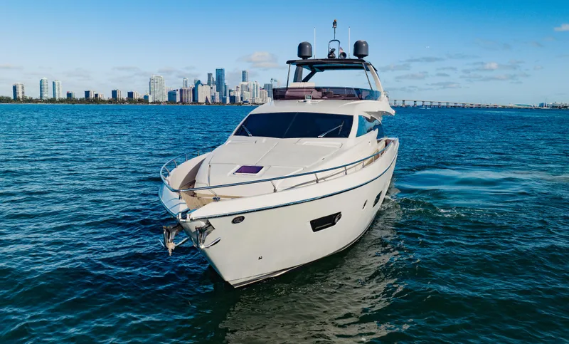 Sami Kay III Yacht Photos Pics Luxurious 2017 Ferretti Yachts 750 cruising near city skyline on a sunny day.