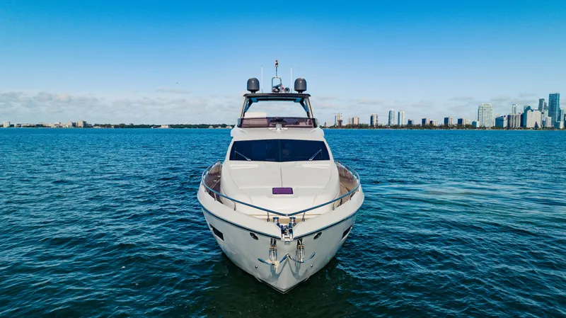 Sami Kay III Yacht Photos Pics 2017 Ferretti Yachts 750 on open water with city skyline backdrop.