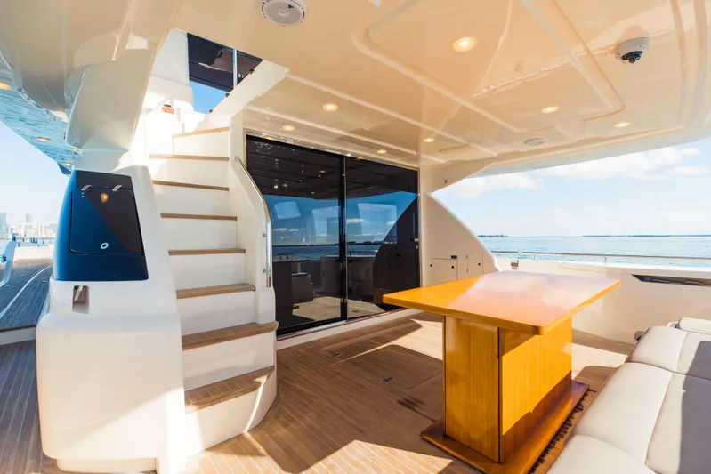 Sami Kay III Yacht Photos Pics Luxurious 2017 Ferretti Yachts 750 interior with elegant wood table and ocean view.