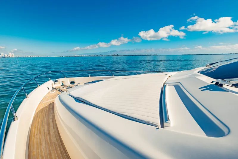 Sami Kay III Yacht Photos Pics Luxurious 2017 Ferretti Yachts 750 cruising on serene blue waters under clear skies.