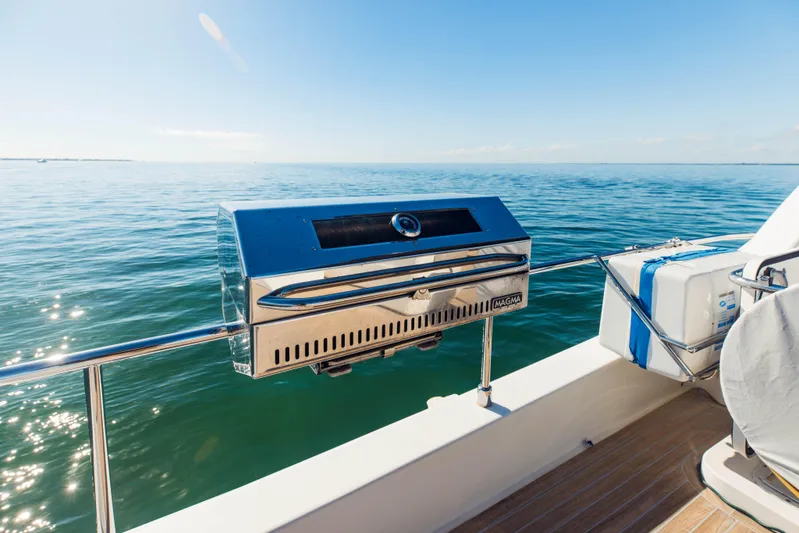 Sami Kay III Yacht Photos Pics Stainless steel grill on 2017 Ferretti Yachts 750, overlooking serene ocean view.