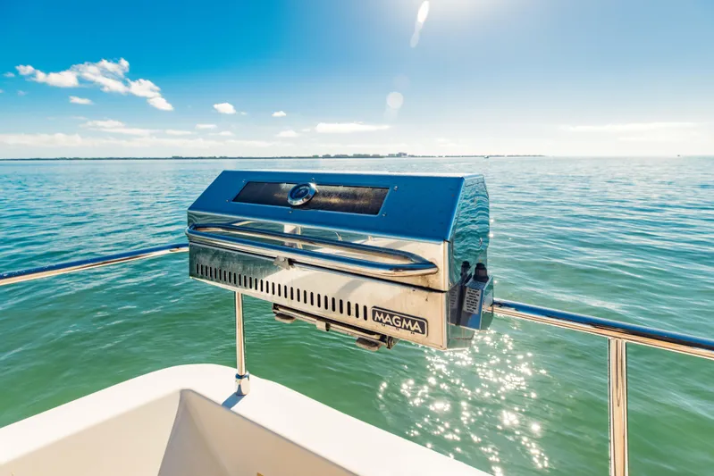 Sami Kay III Yacht Photos Pics Outdoor grill on 2017 Ferretti Yachts 750, overlooking serene ocean view.