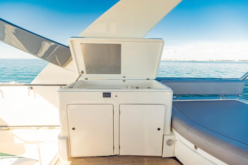 Sami Kay III Yacht Photos Pics Open storage compartment on 2017 Ferretti Yachts 750, with ocean view in background.