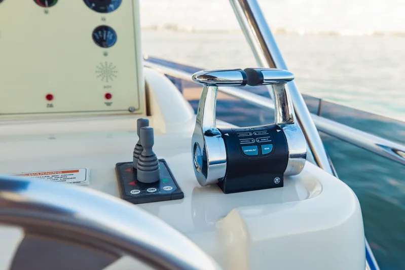 Sami Kay III Yacht Photos Pics Control panel of 2017 Ferretti Yachts 750 with throttle and joystick.