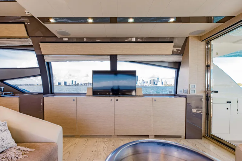 Sami Kay III Yacht Photos Pics Luxurious interior of 2017 Ferretti Yachts 750 with city skyline view through large windows.