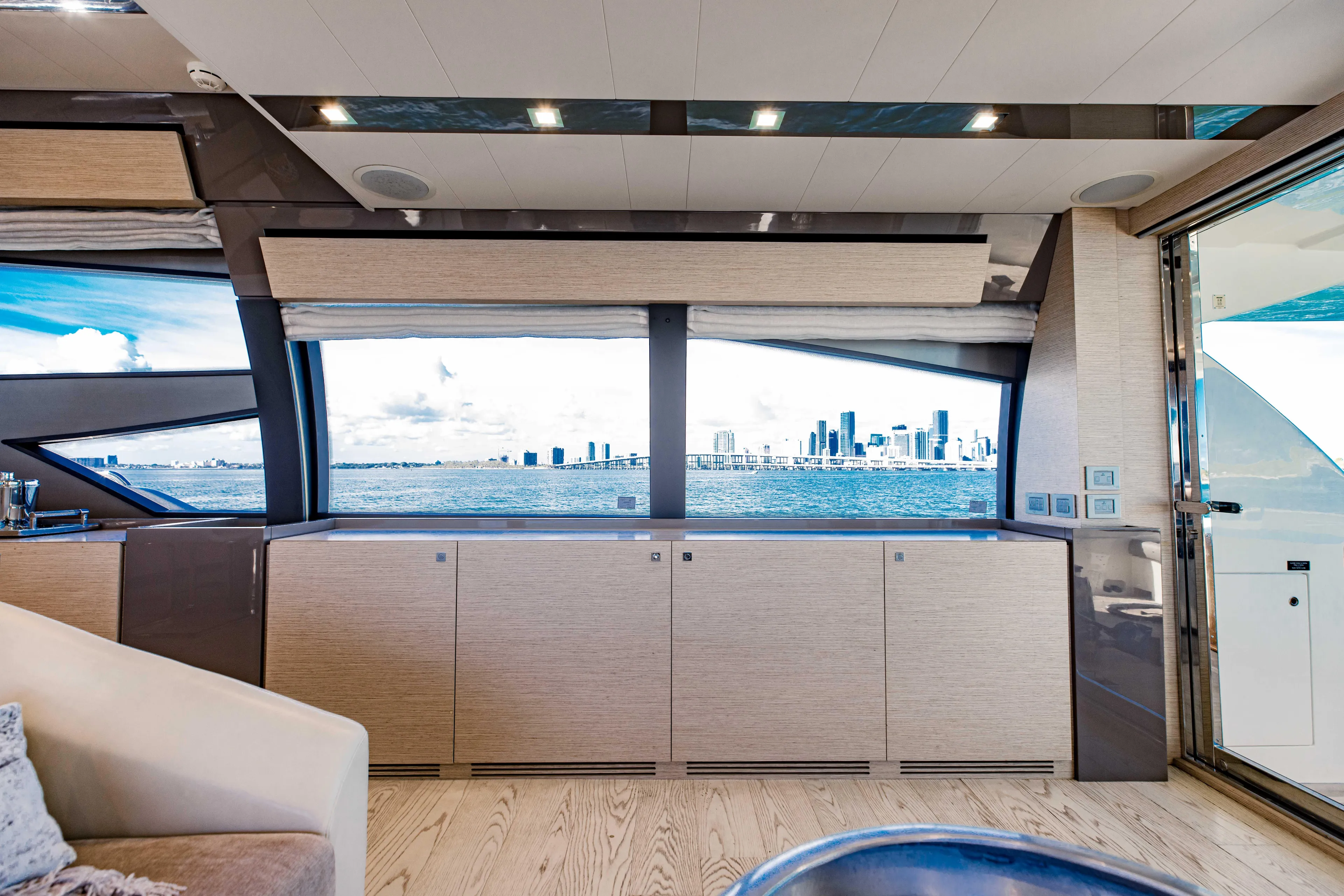 Sami Kay III Yacht Photos Pics Luxurious interior of 2017 Ferretti Yachts 750 with ocean view through large windows.