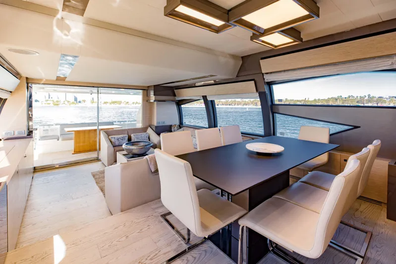 Sami Kay III Yacht Photos Pics Luxurious interior of 2017 Ferretti Yachts 750 with elegant dining area and scenic ocean view.