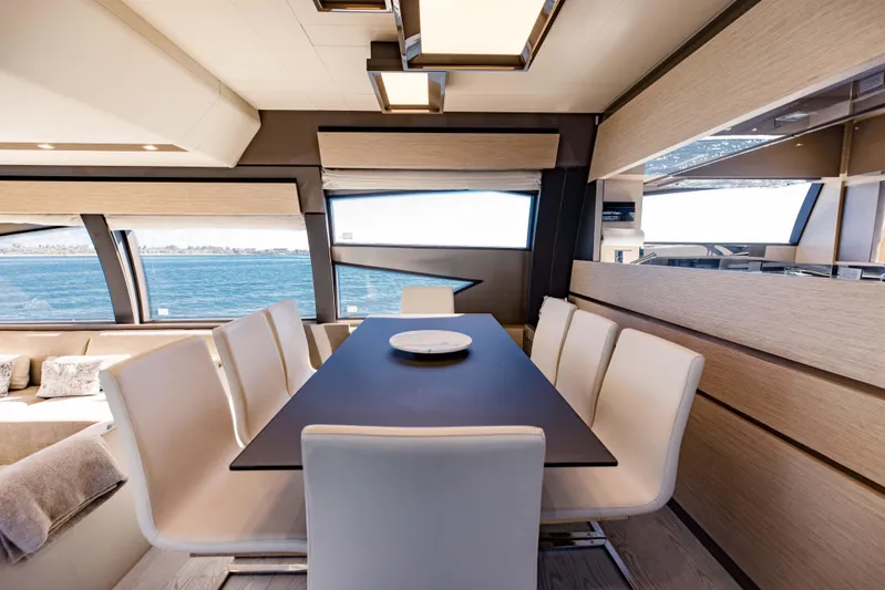 Sami Kay III Yacht Photos Pics Luxurious dining area inside 2017 Ferretti Yachts 750, featuring elegant seating and ocean views.