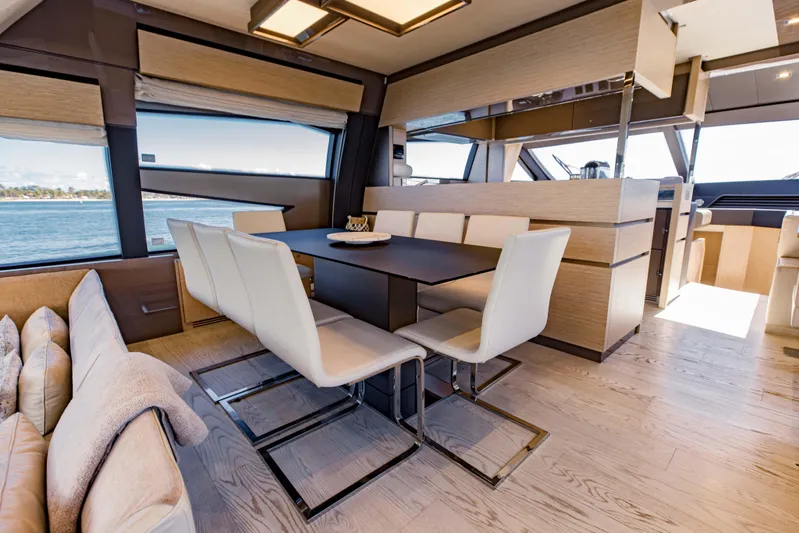 Sami Kay III Yacht Photos Pics Luxurious interior of 2017 Ferretti Yachts 750 with elegant dining area and panoramic windows.