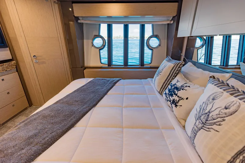 Sami Kay III Yacht Photos Pics Luxurious bedroom interior of 2017 Ferretti Yachts 750 with ocean view windows.