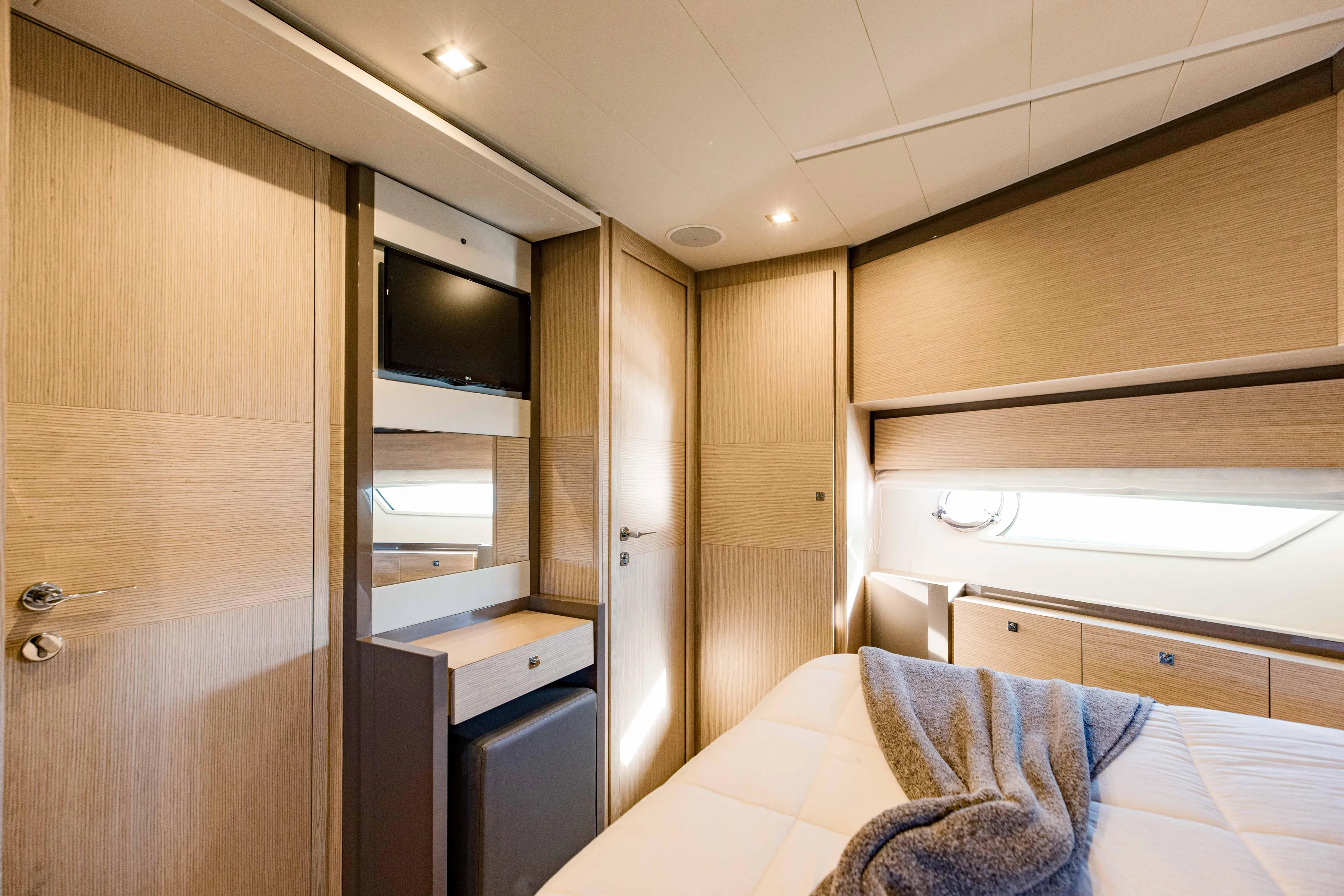 Sami Kay III Yacht Photos Pics Luxurious cabin interior of 2017 Ferretti Yachts 750, featuring modern design and cozy ambiance.