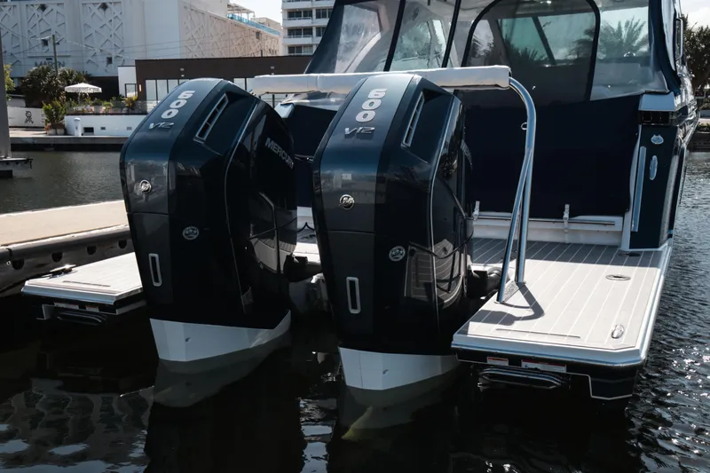  Yacht Photos Pics 2024 Formula 380 Super Sport Crossover OB with dual Mercury outboard engines docked.