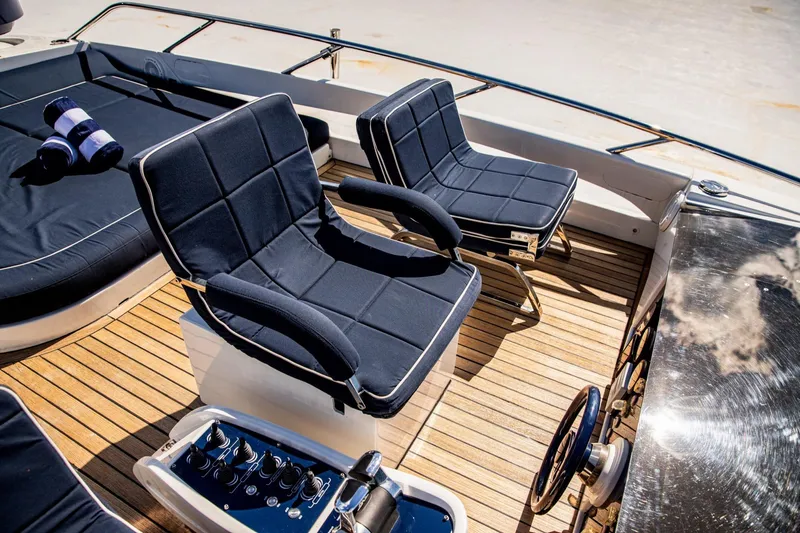 Dorothy Ann Yacht Photos Pics Luxury seating on 2012 Pershing Sport Boat Planning with teak deck and nautical decor.