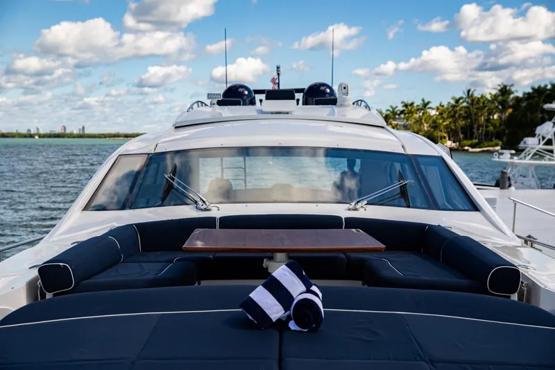 Dorothy Ann Yacht Photos Pics 2012 Pershing Sport Boat Planning on water, featuring luxurious deck seating and table.