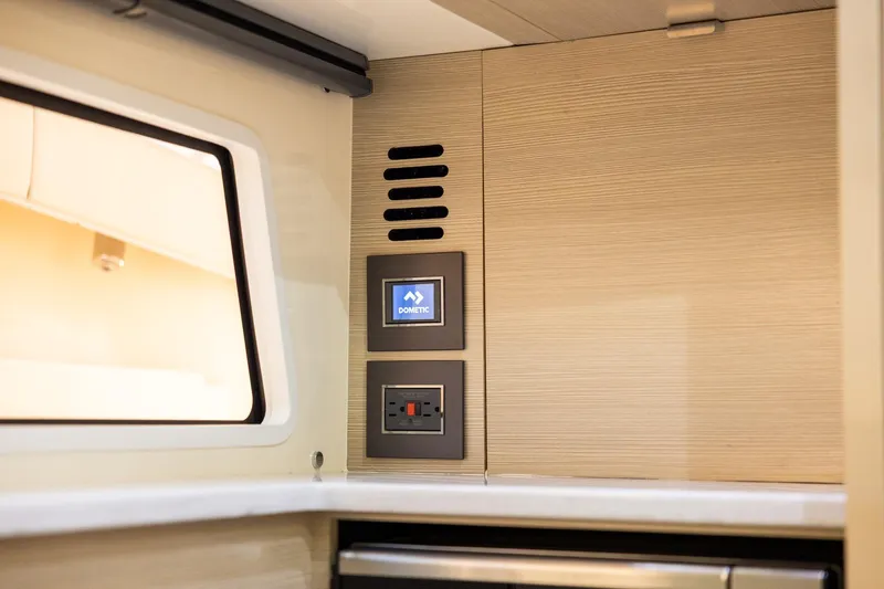  Yacht Photos Pics 2024 Scout 377 LXF interior with Dometic control panel and modern design elements.