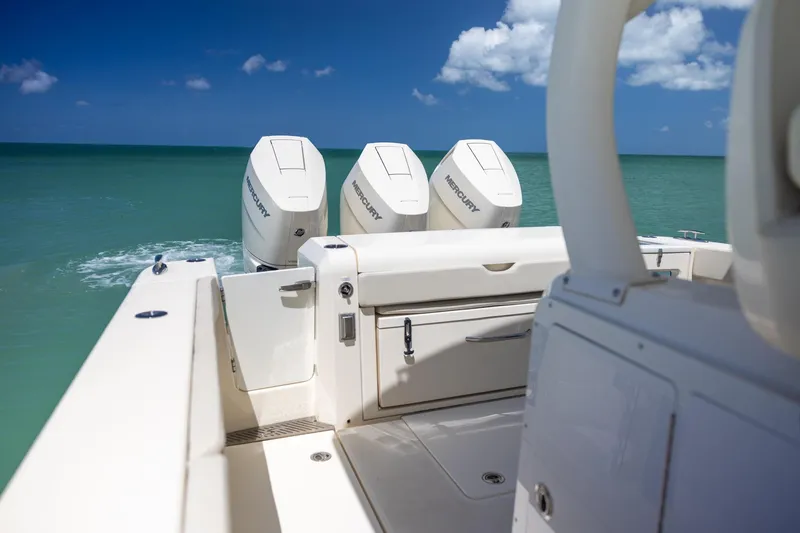  Yacht Photos Pics 2024 Scout 377 LXF boat with triple Mercury engines on open sea.