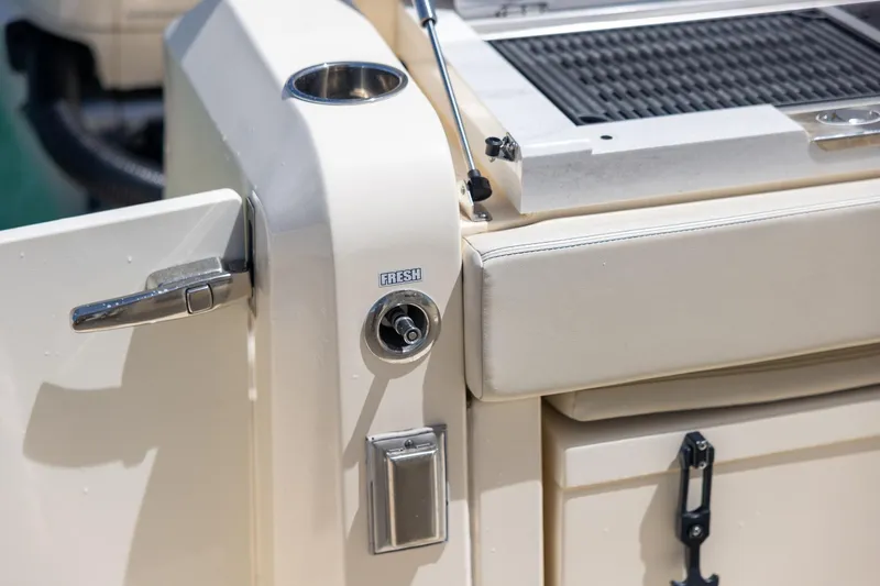  Yacht Photos Pics 2024 Scout 377 LXF boat detail with fresh water outlet and seating area.