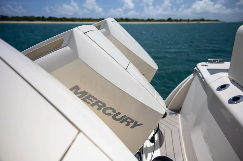  Yacht Photos Pics 2024 Scout 377 LXF boat with Mercury engines on open water.