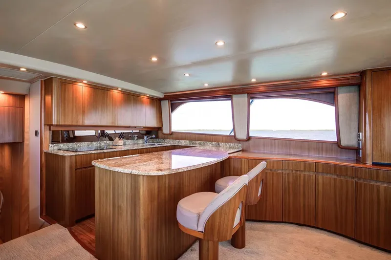 Warden Pass Yacht Photos Pics Luxurious interior of 2010 Viking 57 Sportfish yacht with elegant wood finishes and modern amenities.