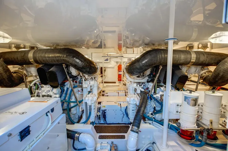 Warden Pass Yacht Photos Pics Engine room of 2010 Viking 57 Sportfish yacht, showcasing dual engines and mechanical systems.